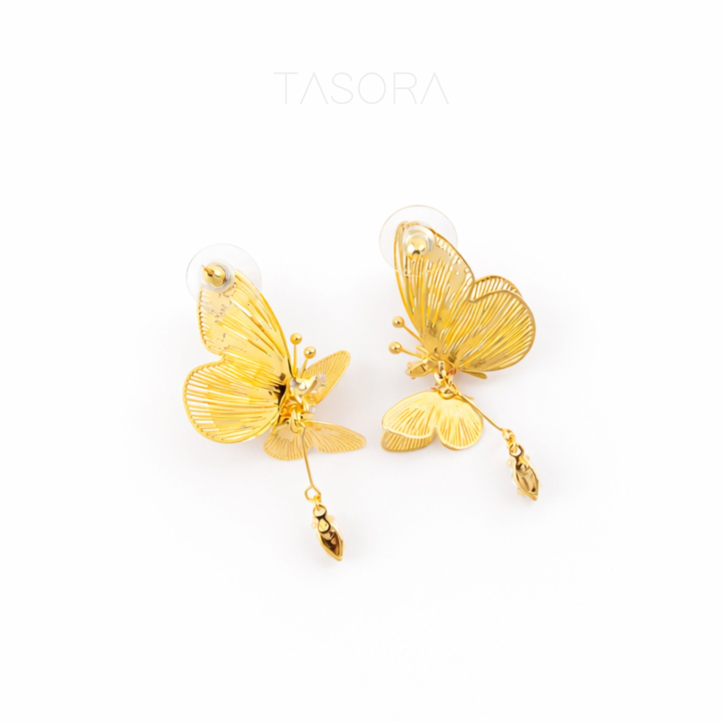 Gold butterfly earrings on a white background with 'TASORA' branding.