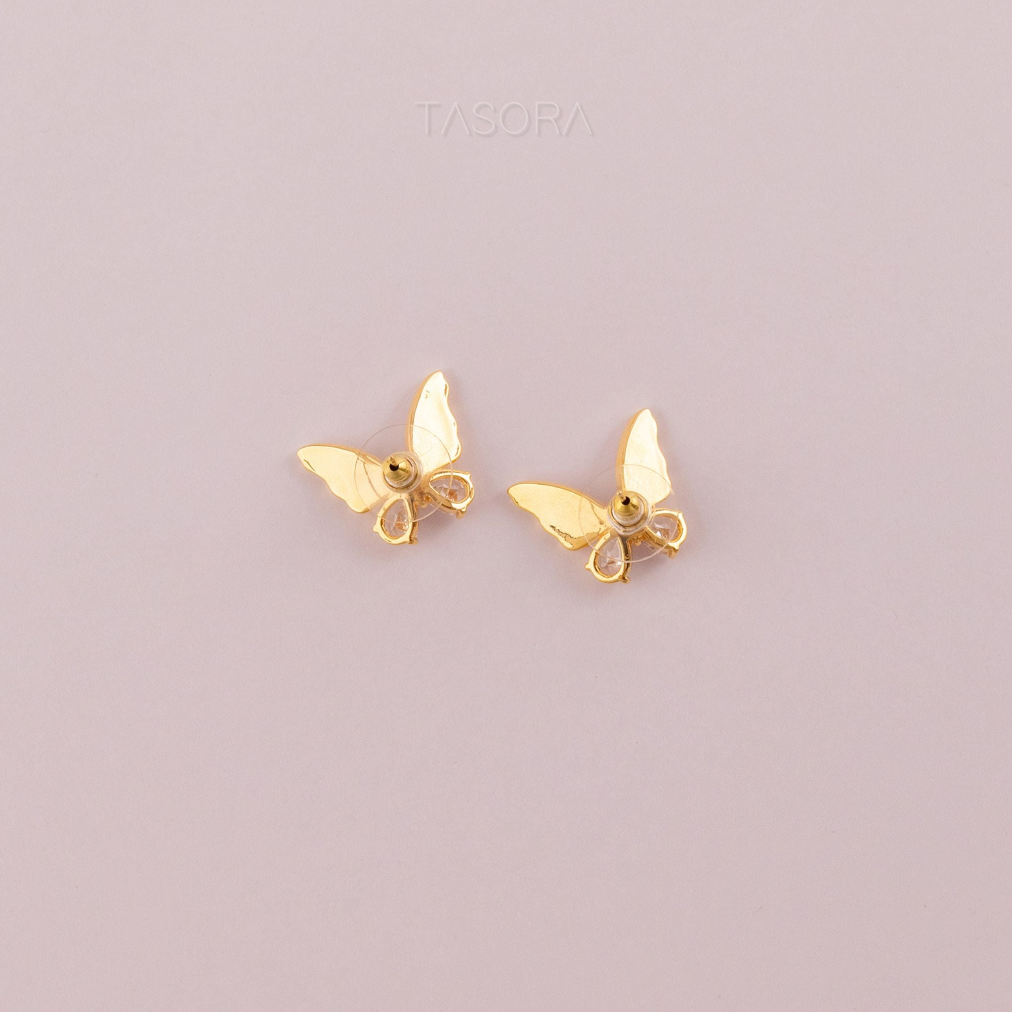 Back side of Flutter wings earrings on a light gray background with TASORA branding