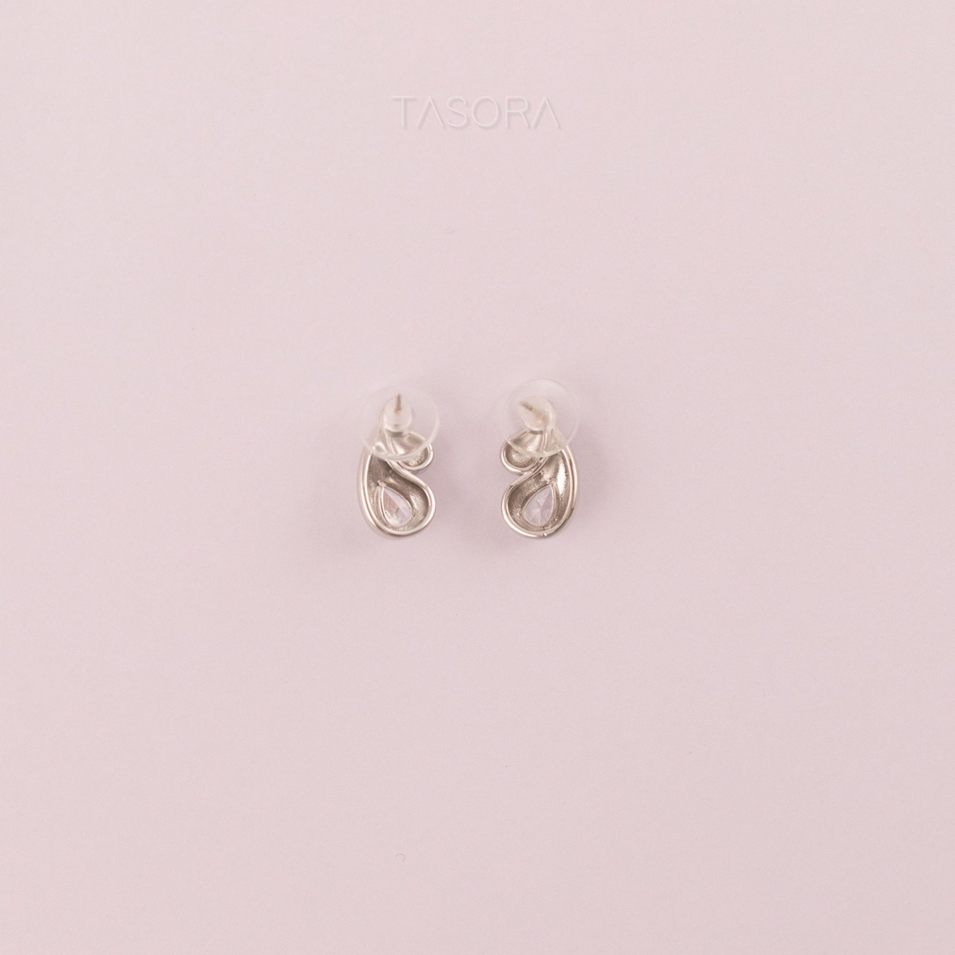 Back Side of Rain Drop Silver earrings on a light natural background